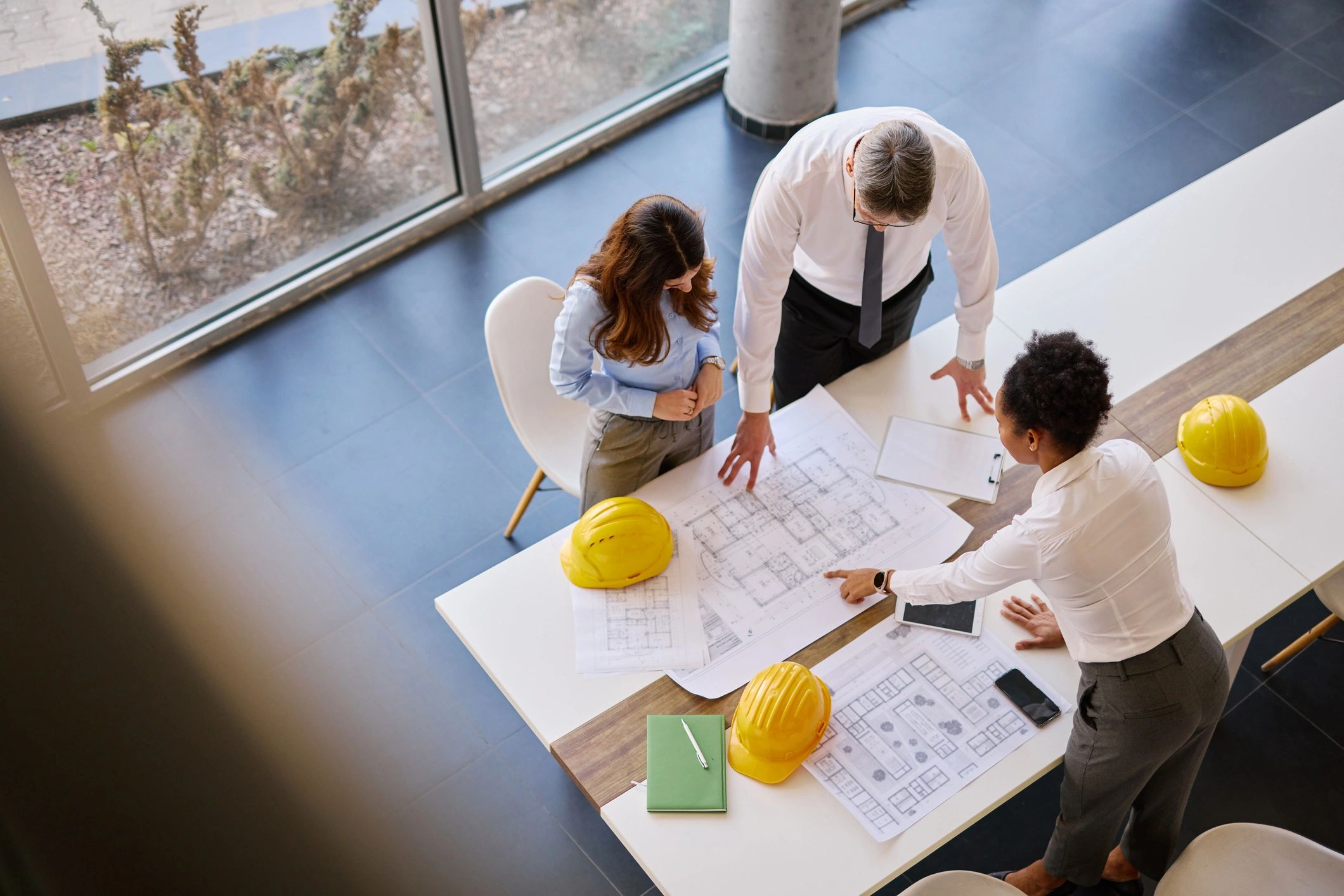 Executive team reviewing technical plans