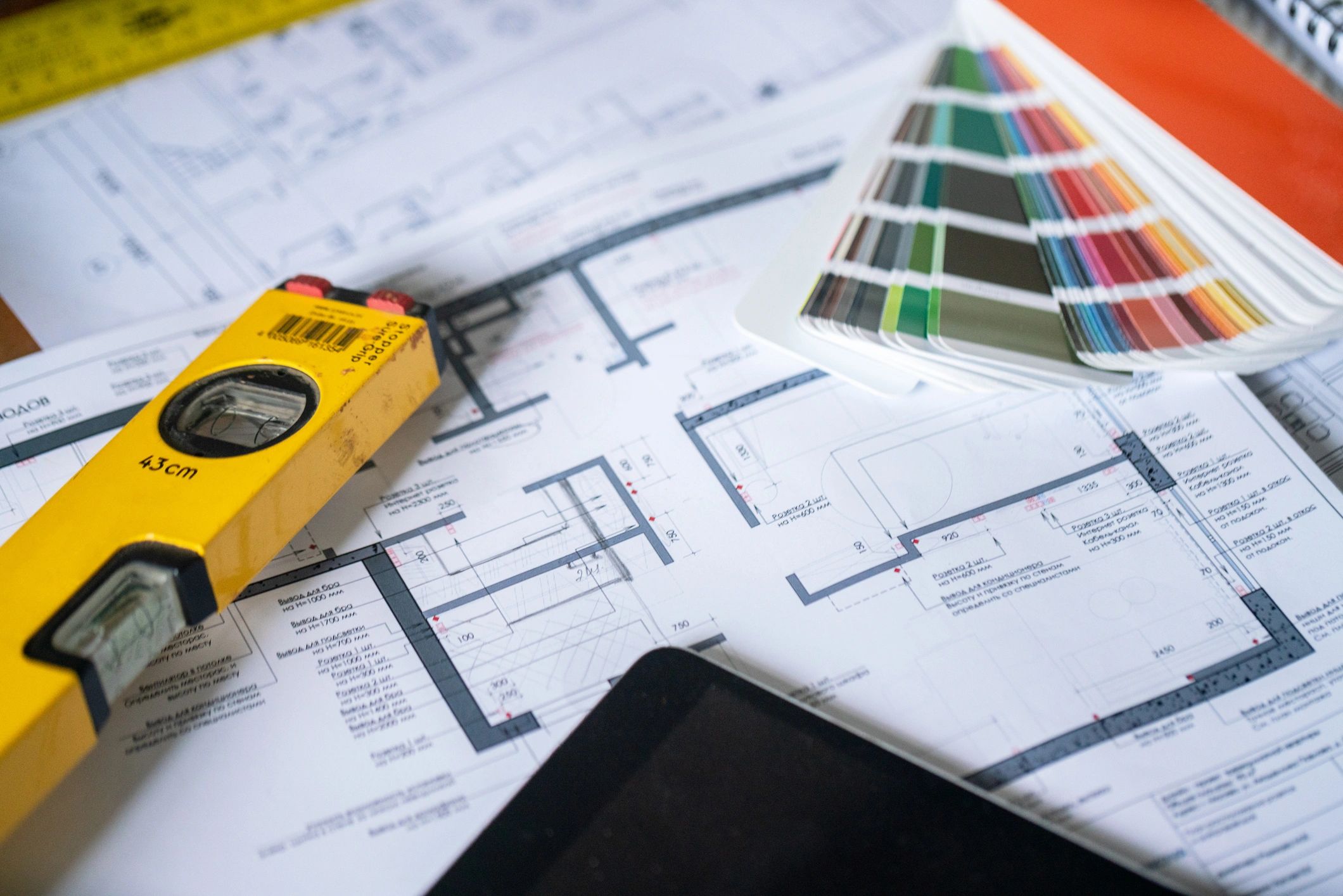 Technical documents and planning tools on desk for maintenance checklists