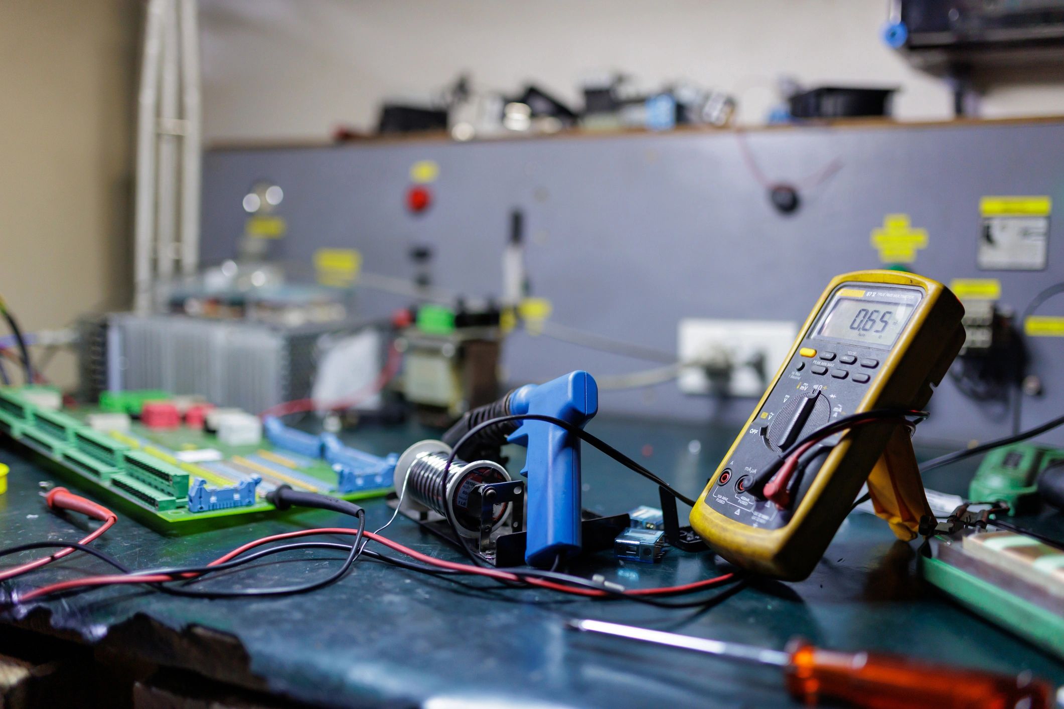 Electronics maintenance workspace with tools and components